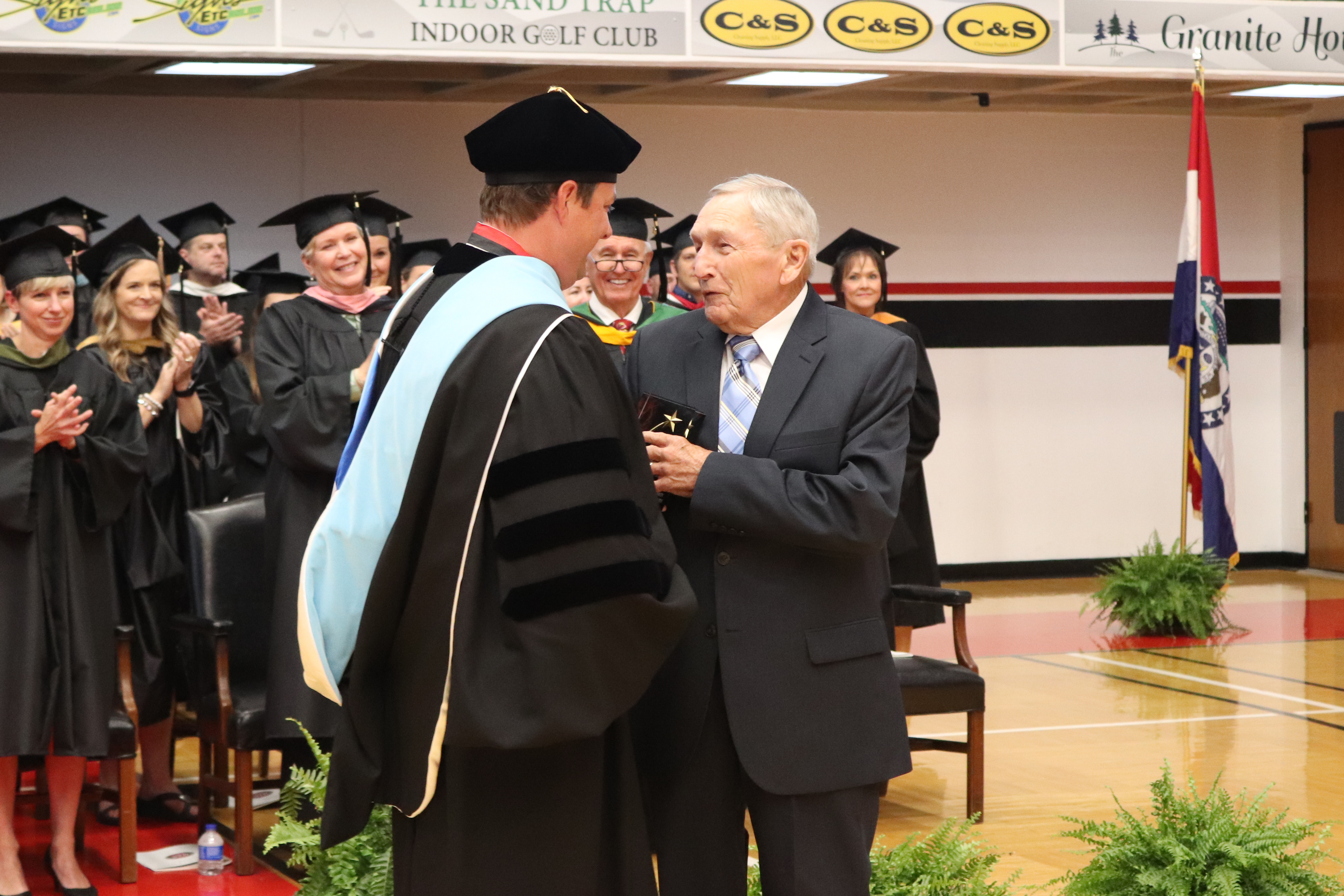 Dr. Gilgour giving Harvey Faircloth an award at graduation
