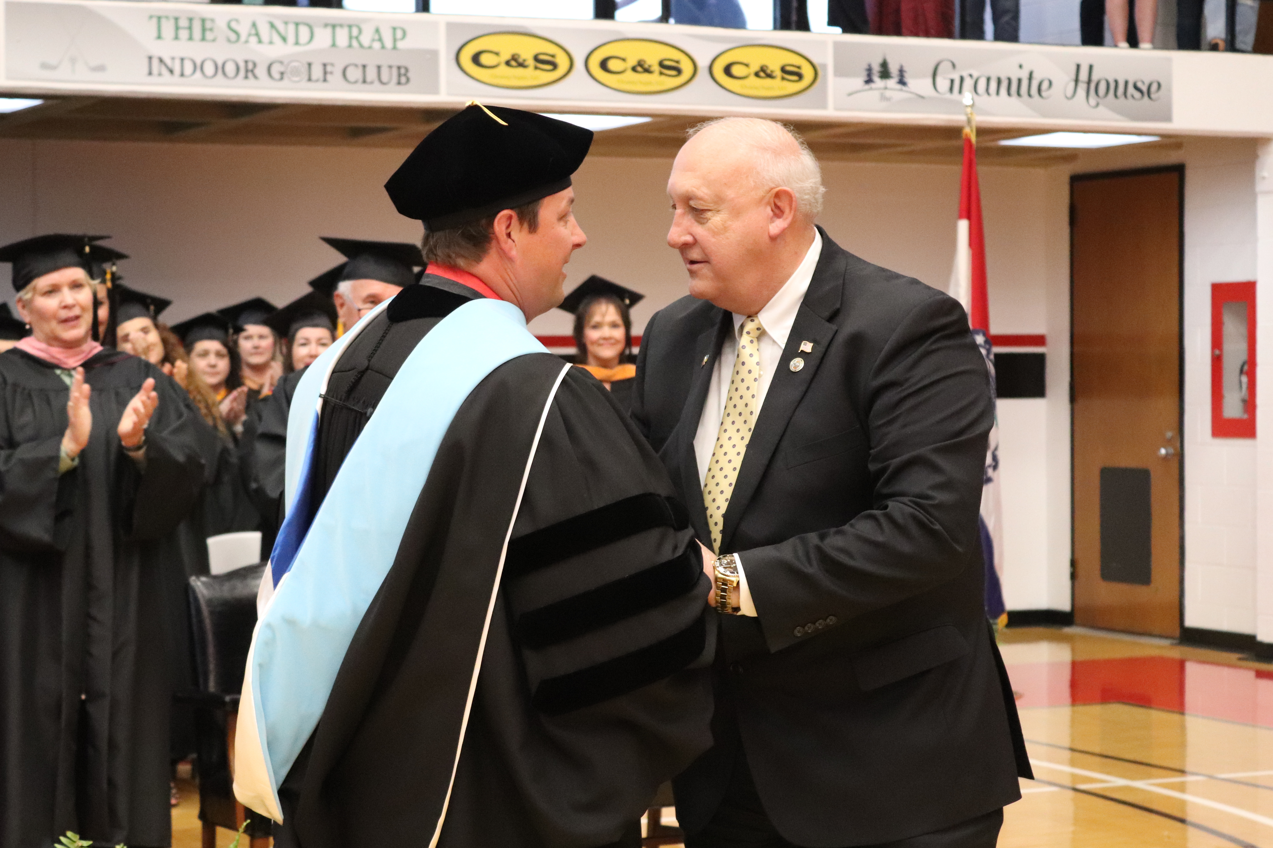 Dr. Gilgour giving Dale Wright an award at graduation