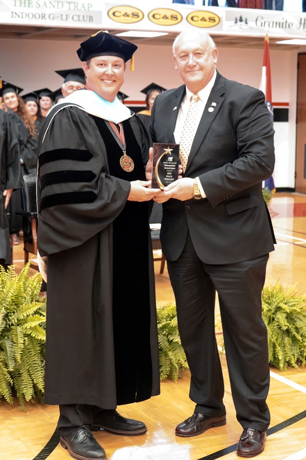 Dr. Gilgour presents Dale Wright with the Distinguished Alumni  Award at the 2023 Commencement Ceremony