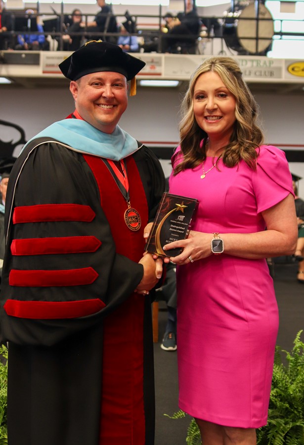 Dr. Gilgour presents Becky Buchanan with the Distinguished Alumni Award